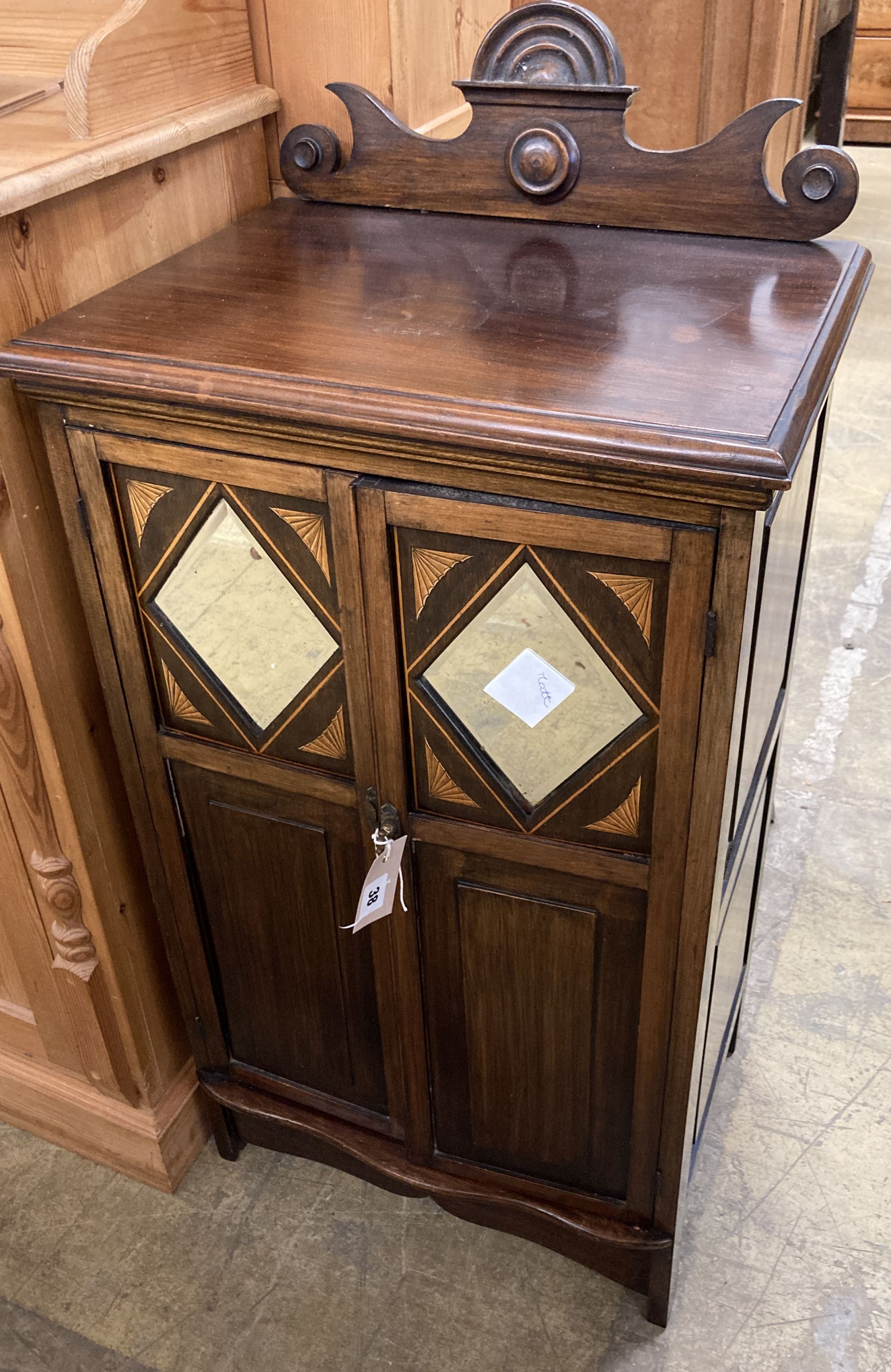 A Victorian inlaid mirrored music cabinet, width 48cm, depth 35cm, height 97cm